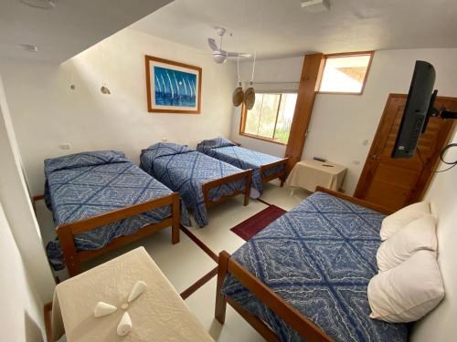 Posteľ alebo postele v izbe v ubytovaní Casa Náutica Beach Guesthouse for Kiters & Surfers