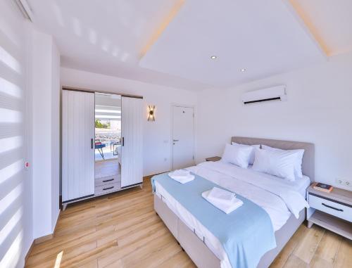 Ένα ή περισσότερα κρεβάτια σε δωμάτιο στο Olive View Penthouse