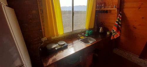 Kuchyň nebo kuchyňský kout v ubytování Cabañas "Los Elementos", San Carlos, Salta,