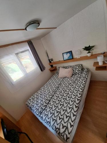 a bedroom with a large bed in a room at Lexi Zen House in Kamnik