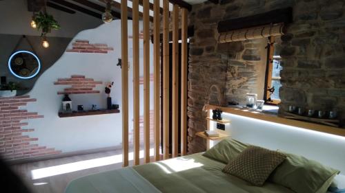A bed or beds in a room at A curuxa casa rural