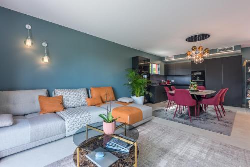 a living room with a couch and a table at Deluxe VILLA GRAZIELLA 200 M FROM THE BEACH in Èze