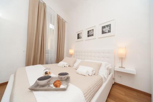 Ένα ή περισσότερα κρεβάτια σε δωμάτιο στο Principi Apartment