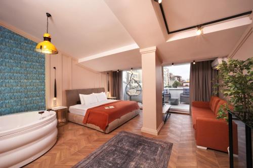 a hotel room with a bed and a bath tub at Harbiye Residence in Istanbul
