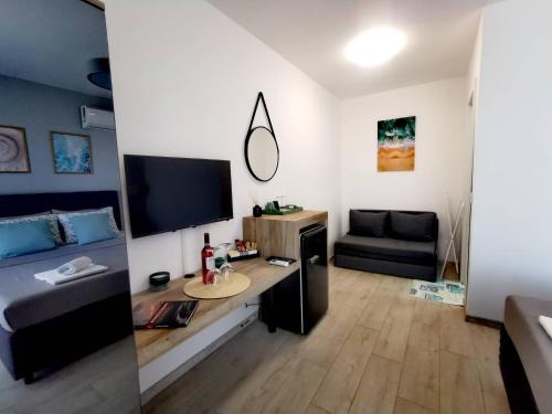 TV a/nebo společenská místnost v ubytování Blue Breeze