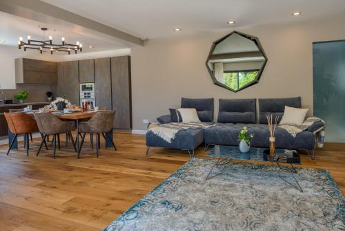 a living room with a couch and a table at Deluxe VILLA GRAZIELLA 200 M FROM THE BEACH in Èze
