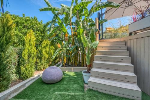 a garden with stairs leading up to a house at Deluxe VILLA GRAZIELLA 200 M FROM THE BEACH in Èze