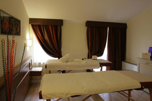 מיטה או מיטות בחדר ב-Hotel Valentino