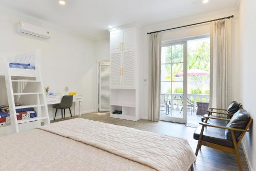 Postel nebo postele na pokoji v ubytování La villa de CoCo Bến Tre