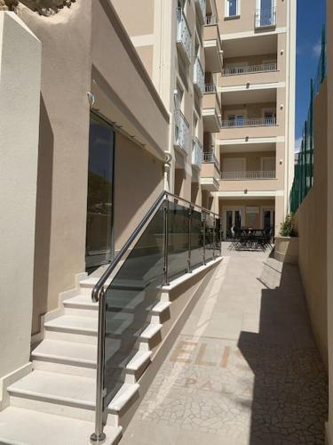 a building with stairs leading to a building at Boutique Apartment - Tropea in Tropea
