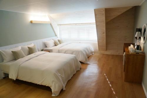 เตียงในห้องที่ Hotel Gaon Golden Park Dongdaemun