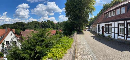 an empty street in a village with buildings at 2-Zimmer Wohnung an der Lindenstraße in Lengerich