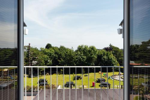 a view of a parking lot through a window at The Imperial Dragon Hotel in Saundersfoot