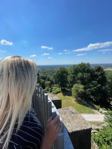 a woman taking a picture of a view from a balcony at 2-Zimmer Wohnung an der Lindenstraße in Lengerich