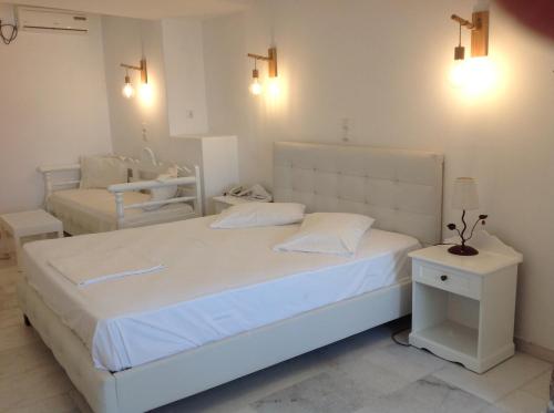Un ou plusieurs lits dans un hébergement de l'établissement Hotel Anixis