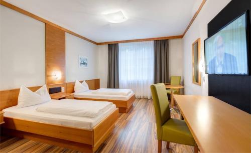 Postel nebo postele na pokoji v ubytování Sporthotel Kurz