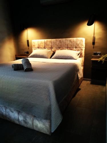 a bedroom with a large bed with white sheets and pillows at House of Silence in Trogir