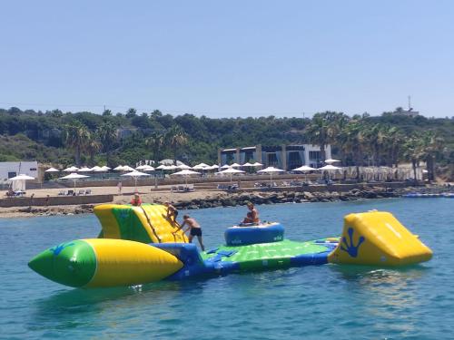 a group of people riding on an inflatableuation in the water at Karpaz Gate Marina Hotel in Ayia Trias