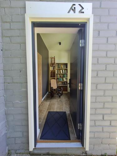 a door into a hallway of a house at E29 in Plateliai