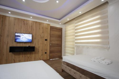 Ένα ή περισσότερα κρεβάτια σε δωμάτιο στο B H B Apartmani
