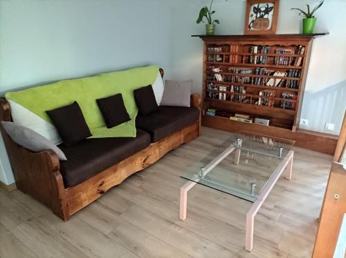 a living room with a couch and a table at Cadol'Ain in Servignat