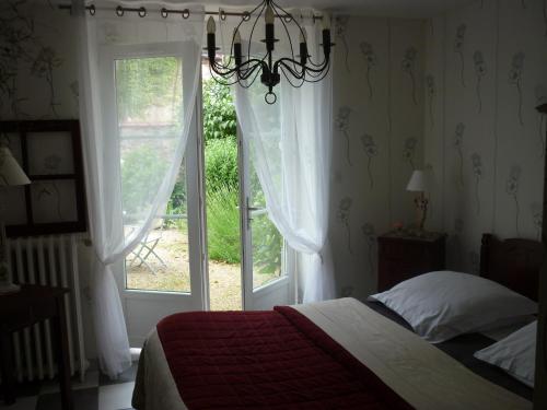 Ένα ή περισσότερα κρεβάτια σε δωμάτιο στο La Maison de Claire