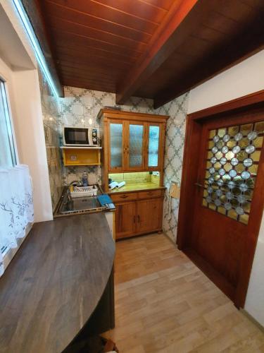a kitchen with a sink and a counter top at Jägerhaus in Nossen