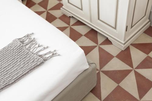 Ein Bett oder Betten in einem Zimmer der Unterkunft Mantatelurè