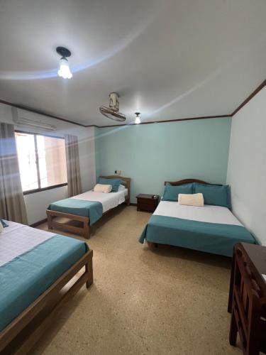 Postel nebo postele na pokoji v ubytování Hotel Caucasia