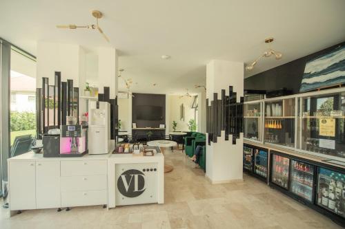 a large room with a store with a v sign on it at Vila Ducu - Adults Only ( +16 ) in Mamaia Nord