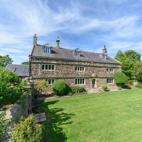 an old stone house with a large yard at 10 Bed Stunning House in village, with Hot Tub in Ovingham