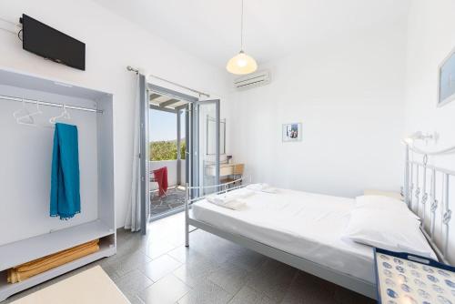 Ένα ή περισσότερα κρεβάτια σε δωμάτιο στο Anna Studios Paros