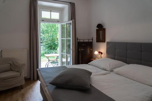 a bedroom with a bed and a sliding glass door at Louisenvilla in Bad Gleichenberg
