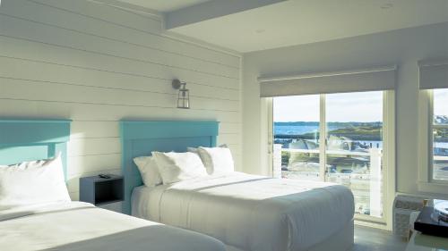 Tempat tidur dalam kamar di Falmouth Tides