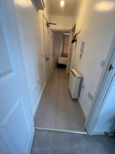 a hallway with a small television in a room at Entire One Bedroom Flat, 5 in Great Yarmouth