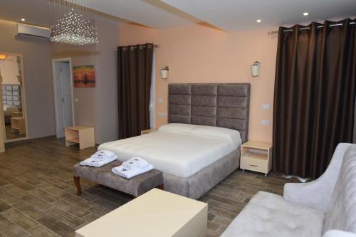 Ένα ή περισσότερα κρεβάτια σε δωμάτιο στο Monte Mare Hotel