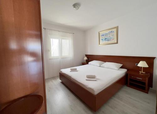 Llit o llits en una habitació de Apartments Obad