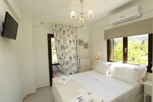 Ένα ή περισσότερα κρεβάτια σε δωμάτιο στο Levantes Villas