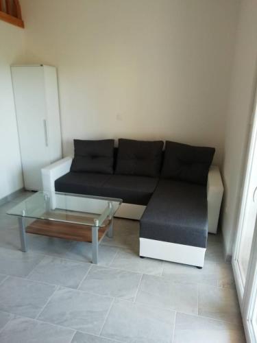 a living room with a couch and a coffee table at Deni09 in Pomer