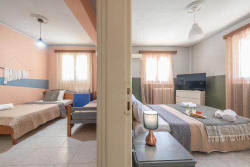 a living room with a bed and a couch at Castle's nest 2 in Kástro Tornéze