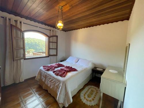 A bed or beds in a room at MORADA NETUNO GODOY