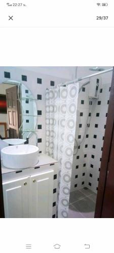 a bathroom with a white sink and a mirror at Wirason villa 2BR in Koh Samui 