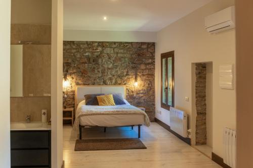 מיטה או מיטות בחדר ב-La Borda de Chelis