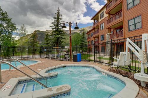 a hot tub in a courtyard next to a building at CS407 Copper Springs condo in Copper Mountain