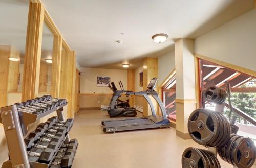 a gym with treadmills and ellipticals in a room at CS407 Copper Springs condo in Copper Mountain
