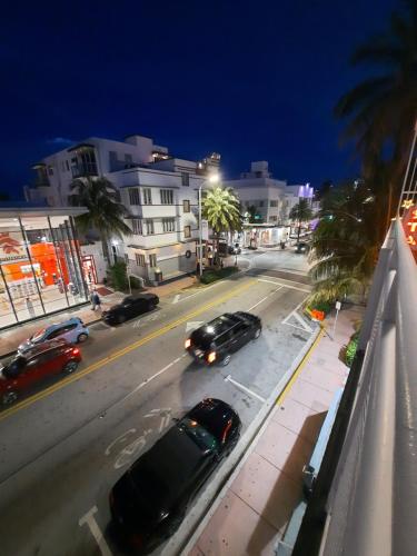 a view of a city street at night with cars at Stardust Hotel in Miami Beach