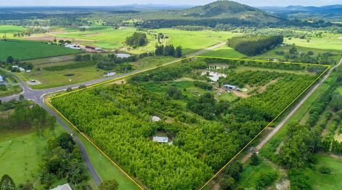 an aerial view of a field with a road at GSM Bamboo Farm RV and Caravan site in Gundiah