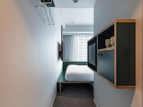 Кровать или кровати в номере all day place shibuya