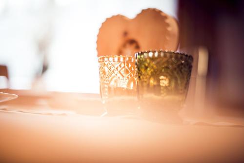 a pair of glasses sitting on a table at Alpenpension Pfurtscheller in Neustift im Stubaital