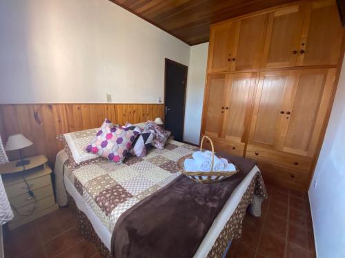 Een bed of bedden in een kamer bij Hospedagem Vó Rosa